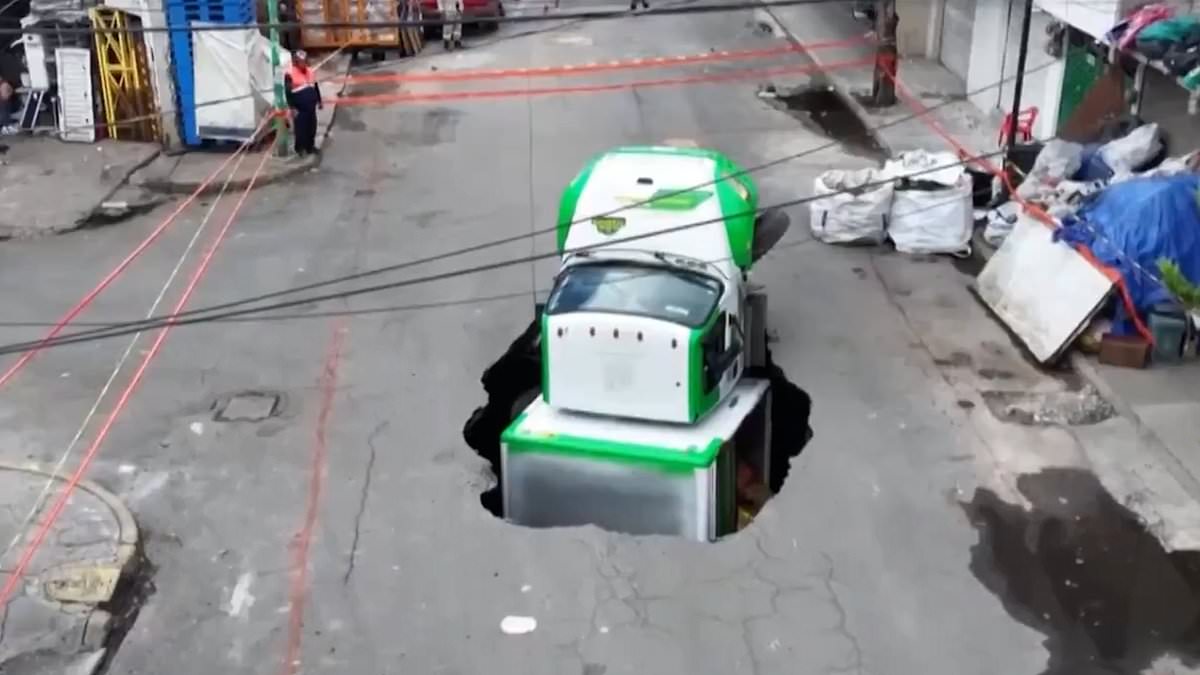 Moment soda truck is swallowed whole by giant sinkhole